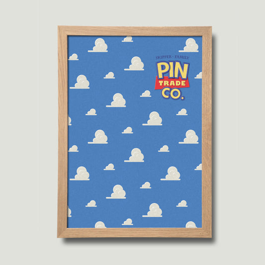 framed in natural wood, cork pin trading board displays andys room wallpaper in the background.